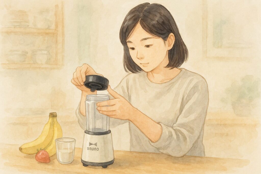 ブレンダーの安全ロックを確認しながら再組み立てする日本人を描いた水彩画風イラスト。